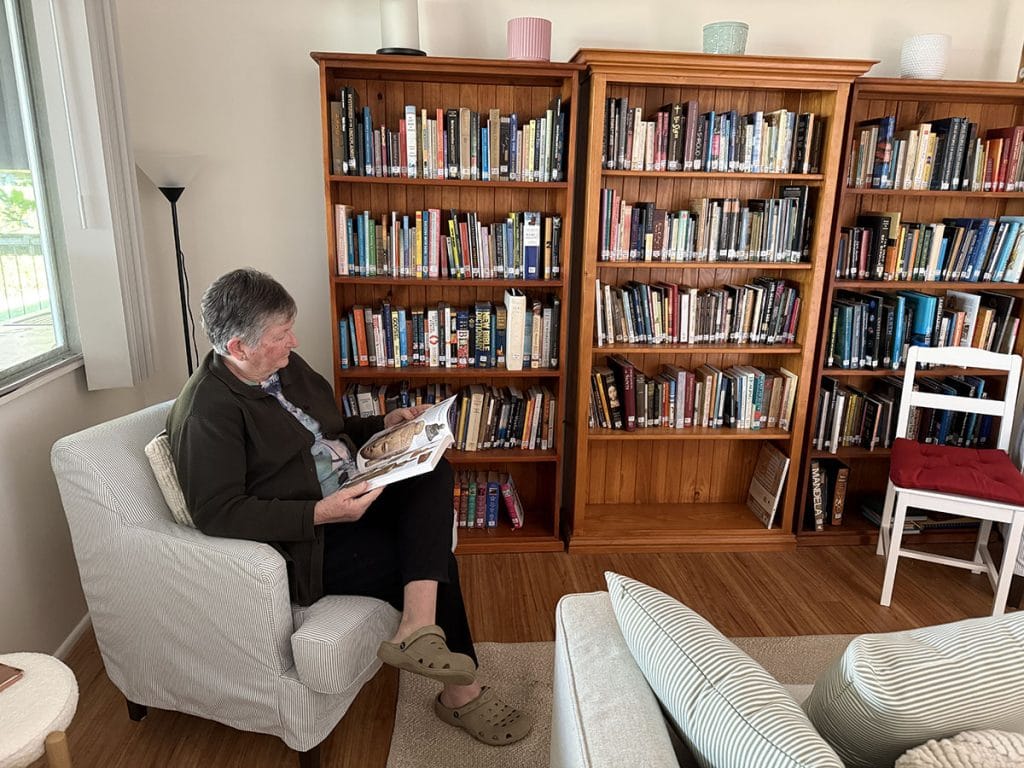 Community Member enjoying the solitude of the Abbey Retreat reading room