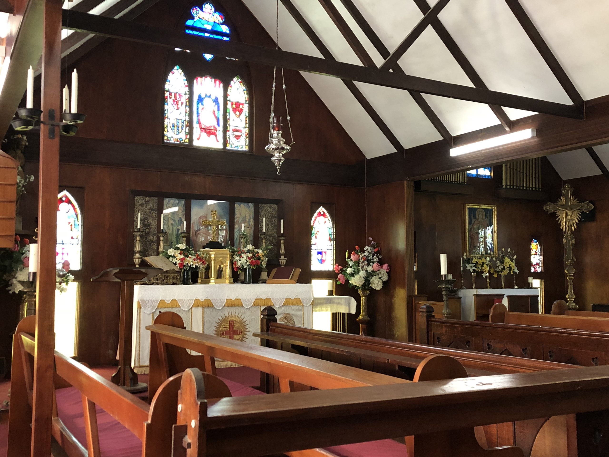 Interior of Abbey Church with altar and stained glass windows