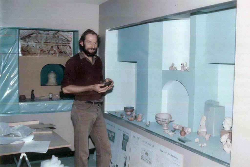 Museum curator preparing an exhibit display