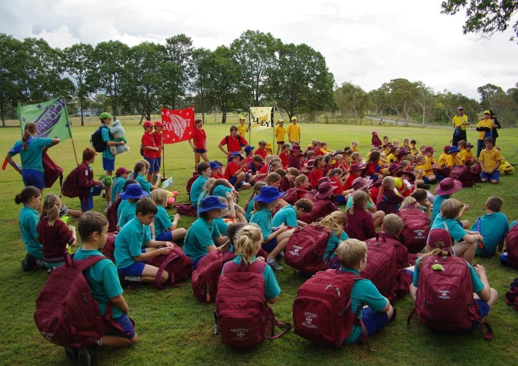 Abbey Community St Michaels College Sports House Teams Primary school students gathered by sports house teams during a St Michael's College athletics carnival in Caboolture Queensland