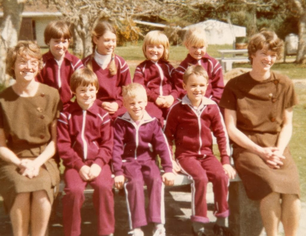Three of the first St Michael's College students wearing the original school uniform during the school's early years. Three early St Michael's College students wearing the original school uniform.