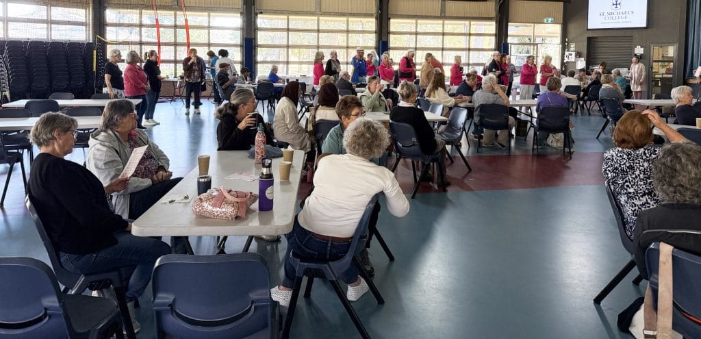 Volunteers assemble birthing kits at the Abbey Community, Caboolture
